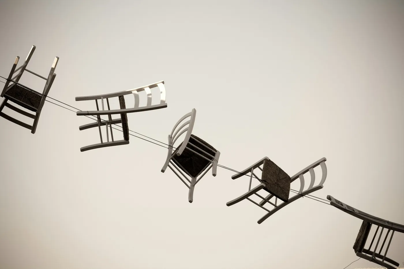Five brown wooden chairs