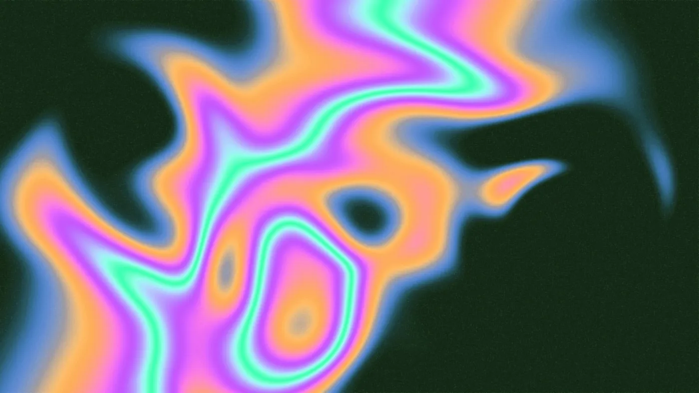 A blurry image of a black background with multicoloured lines